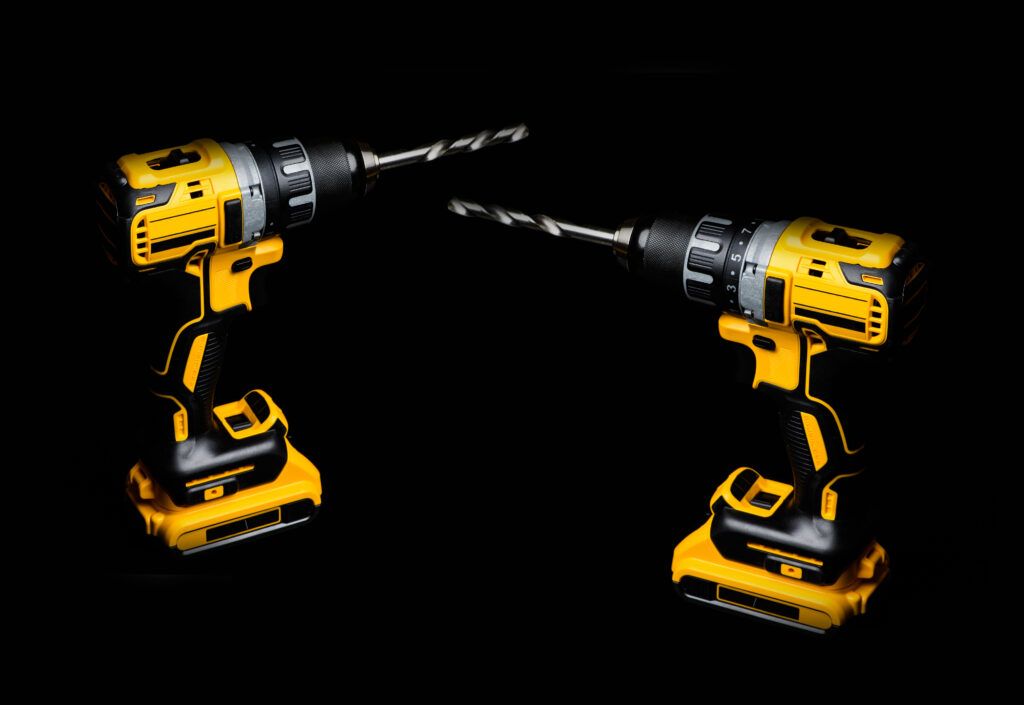 cordless drill and a drill on a black background